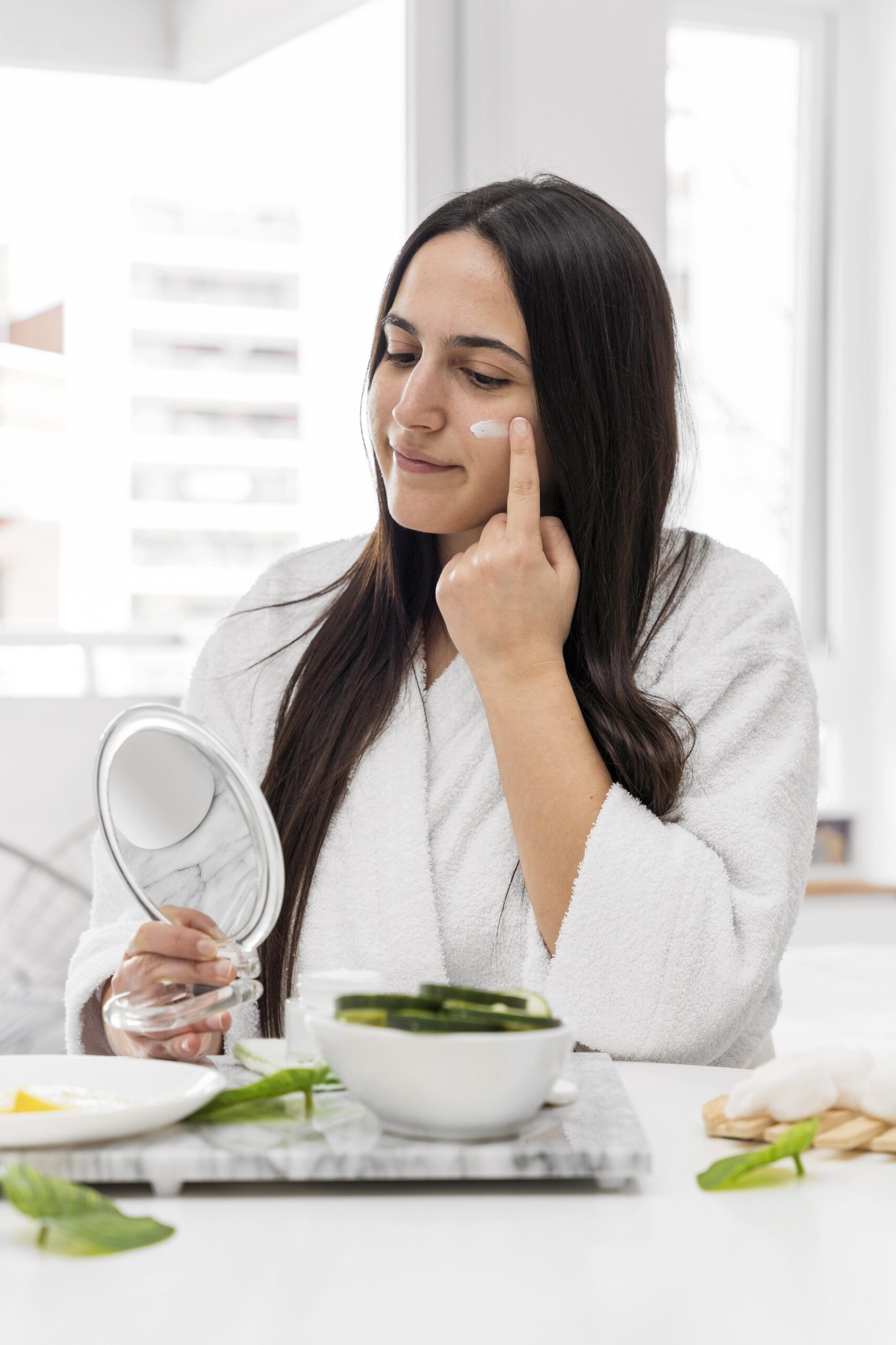 medium-shot-woman-applying-face-cream